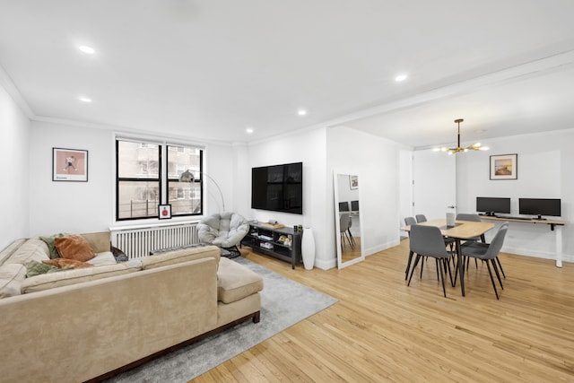 living area with recessed lighting, an inviting chandelier, light wood-style flooring, and crown molding