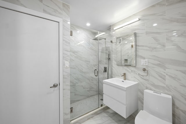 bathroom with vanity, a marble finish shower, recessed lighting, toilet, and marble finish floor