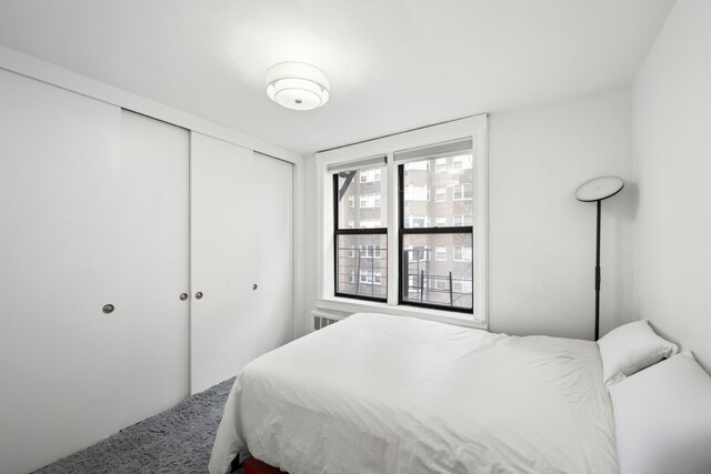 150 E 27th St Unit 4Fg, New York City, NY 10016 - bedroom with ceiling fan, radiator, wood finished floors, and ornamental molding