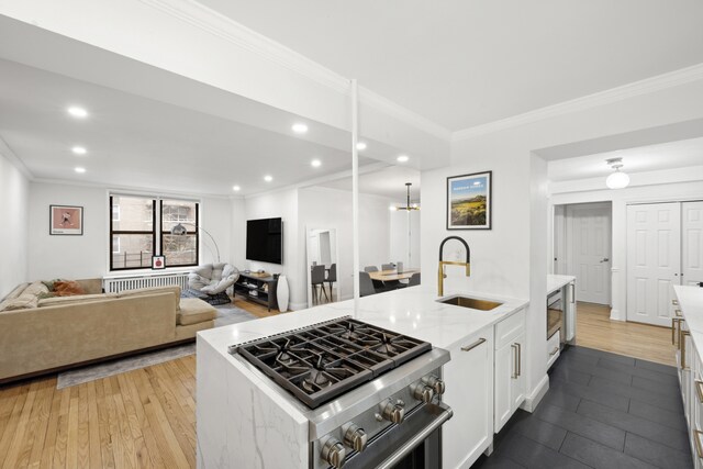 150 E 27th St Unit 4Fg, New York City, NY 10016 - living area featuring light wood finished floors, recessed lighting, and crown molding