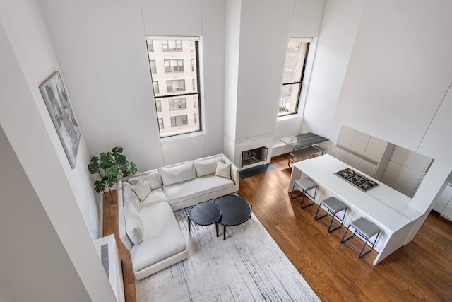 living room featuring visible vents and wood finished floors