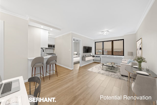 living room with light wood-type flooring, baseboards, radiator heating unit, and crown molding