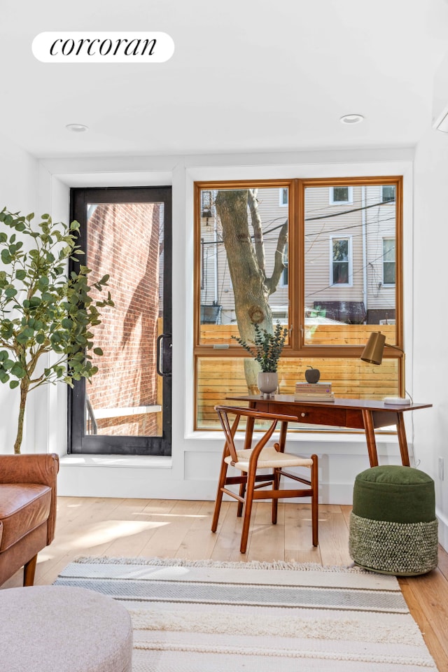 home office with plenty of natural light and wood finished floors