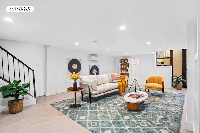 living area with stairs, an AC wall unit, visible vents, and recessed lighting