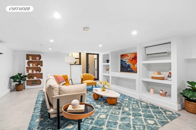 living room featuring a wall mounted air conditioner, visible vents, built in shelves, recessed lighting, and baseboards