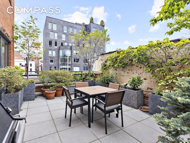 view of patio / terrace featuring outdoor dining space and fence