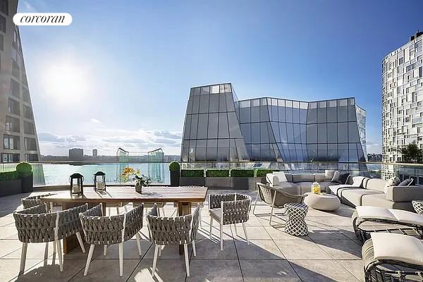 view of patio / terrace with a water view and an outdoor hangout area