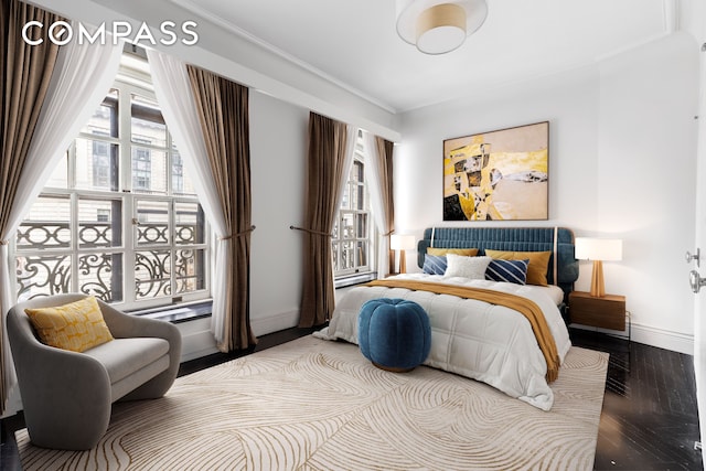 2109 Broadway Unit 5109, New York City, NY 10023 - bedroom with multiple windows, baseboards, and wood finished floors