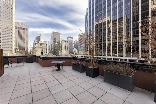 view of patio / terrace featuring a city view