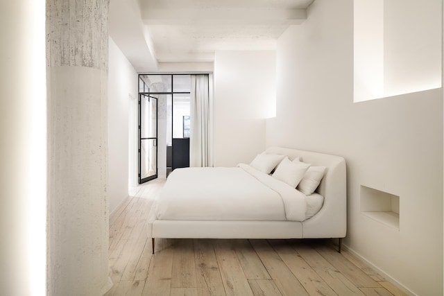 bedroom with wood-type flooring