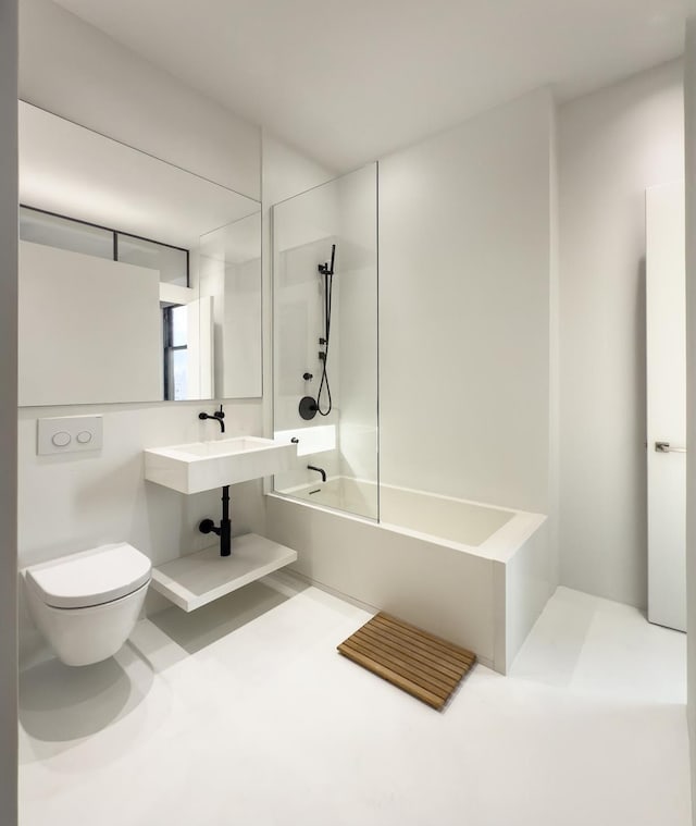 bathroom featuring toilet and bathtub / shower combination