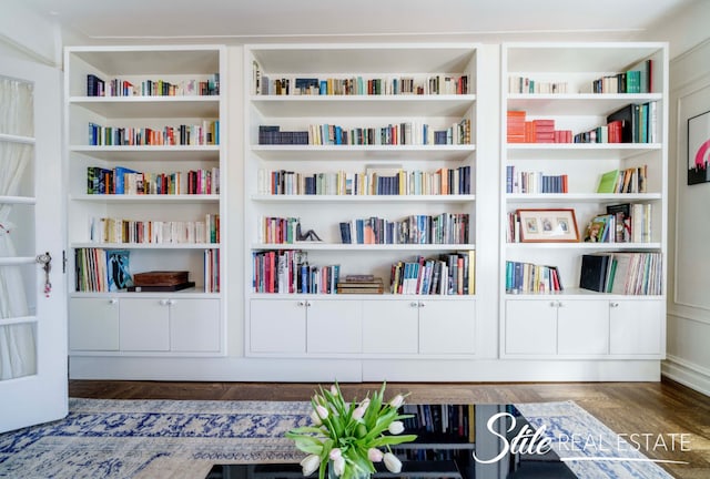 details featuring built in shelves and wood finished floors