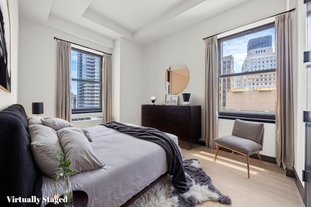 20 Pine St Unit 2907, New York City, NY 10005 - bedroom with light wood finished floors and a raised ceiling