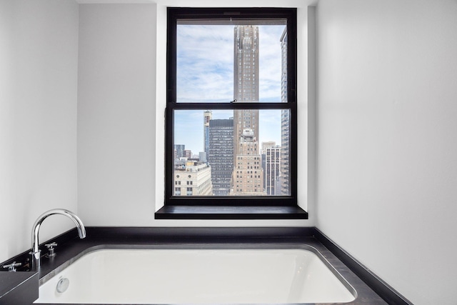 20 Pine St Unit 2907, New York City, NY 10005 - bathroom with a bath and a city view
