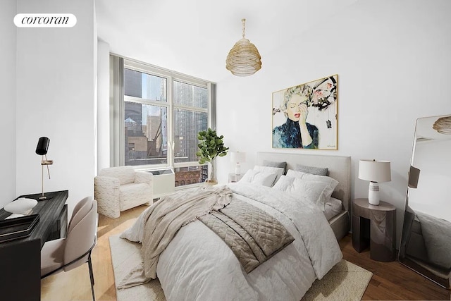 1600 Broadway Unit 16G, New York City, NY 10019 - bedroom featuring wood finished floors