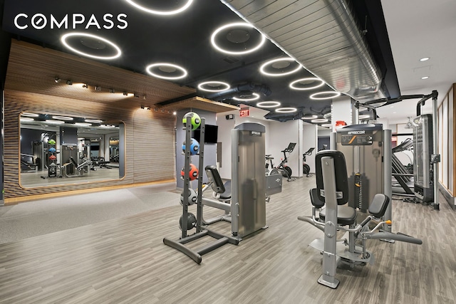 gym featuring wood finished floors