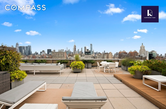 view of patio / terrace with a city view and an outdoor hangout area