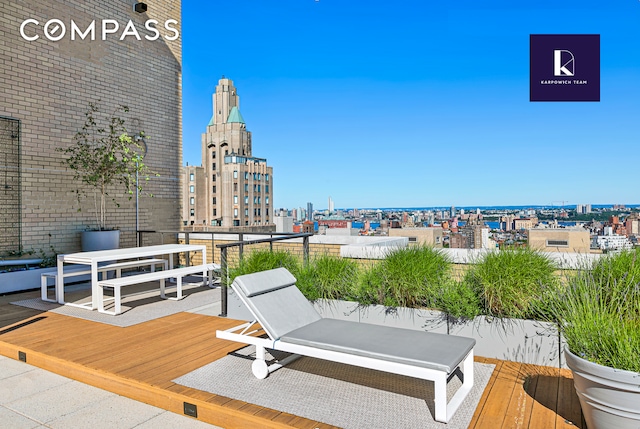 wooden deck with a view of city