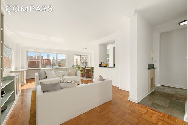 living room with baseboards and a view of city