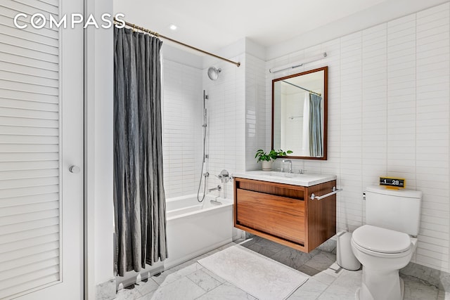 full bathroom with toilet, tile walls, shower / bath combo, and vanity