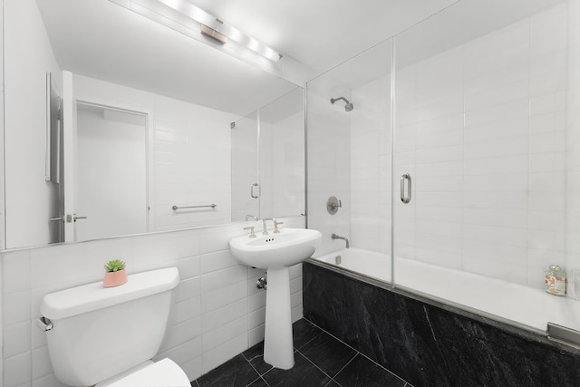 305 2nd Ave Unit 530, New York City, NY 10003 - full bathroom with tiled shower / bath, toilet, tile walls, tile patterned flooring, and a sink