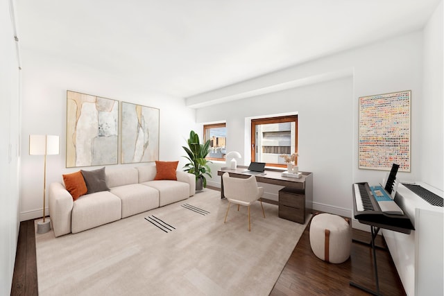 305 2nd Ave Unit 530, New York City, NY 10003 - living area with wood finished floors, a desk, and baseboards