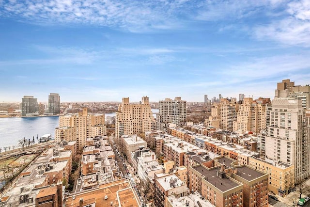 aerial view featuring a city view and a water view