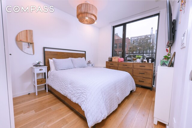 548 Lafayette Ave Unit 1A, New York City, NY 11205 - bedroom with light wood finished floors and baseboards