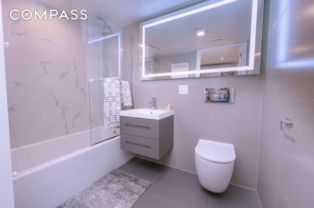 548 Lafayette Ave Unit 1A, New York City, NY 11205 - bathroom featuring tile patterned flooring, vanity,  shower combination, and toilet
