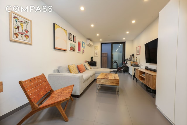 tiled living room featuring recessed lighting and a wall mounted air conditioner