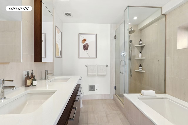 full bath with visible vents, a sink, and a shower stall