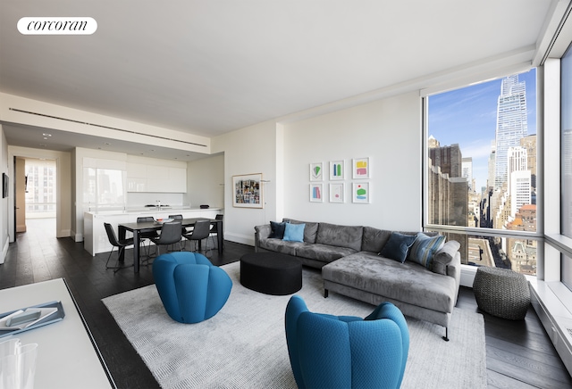 living room with visible vents, a view of city, and dark wood-style floors