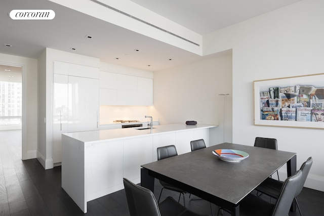 dining room featuring visible vents and dark wood-type flooring