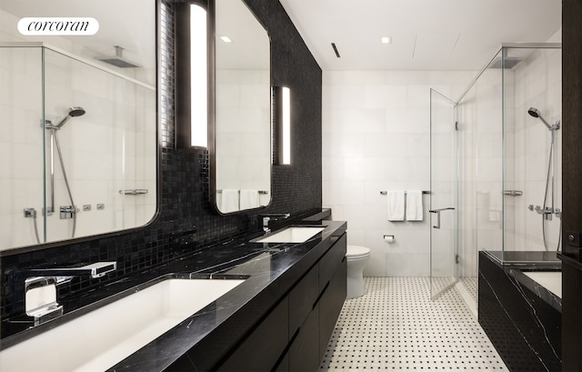 full bath featuring a sink, visible vents, toilet, and a stall shower