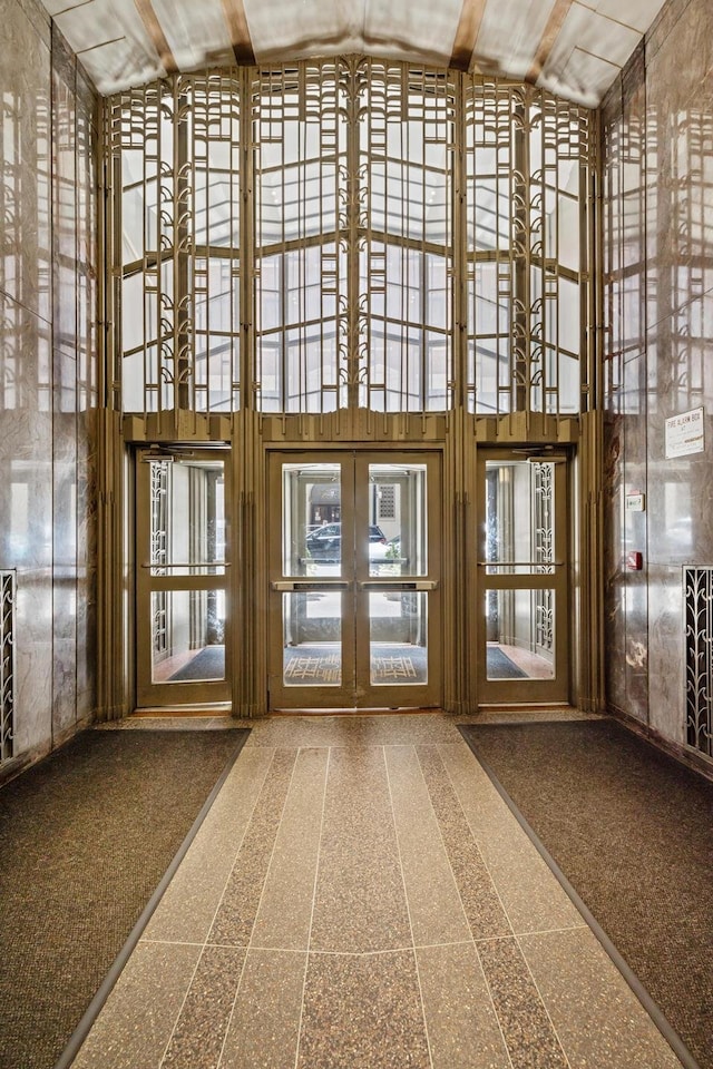 misc room with a towering ceiling