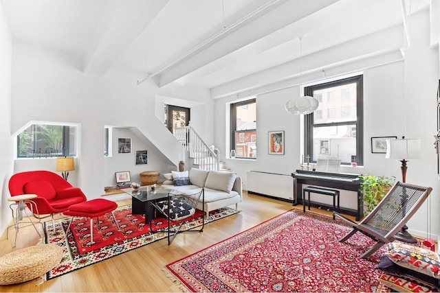 365 Bridge St Unit 2P, New York City, NY 11201 - living room with wood finished floors, stairway, and beam ceiling