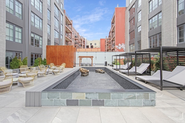 view of property's community with a patio