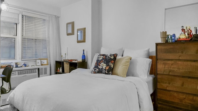 bedroom featuring an AC wall unit