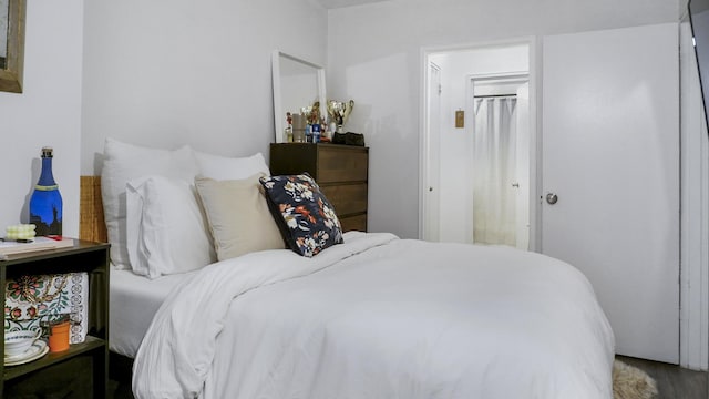 bedroom with wood finished floors