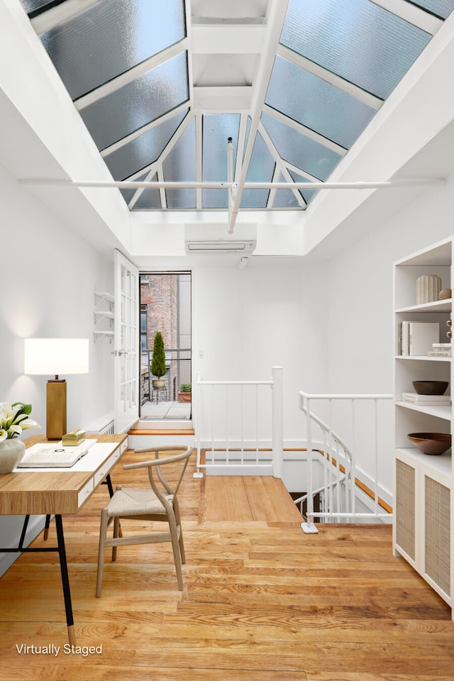 interior space featuring an upstairs landing and wood finished floors