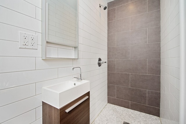 775 Riverside Dr Unit 3D, New York City, NY 10032 - bathroom featuring vanity, a tile shower, and decorative backsplash