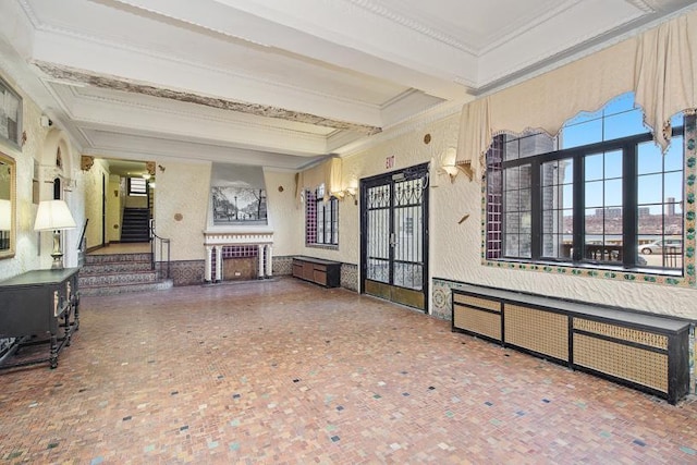 775 Riverside Dr Unit 3D, New York City, NY 10032 - living area featuring crown molding, stairs, a fireplace, beam ceiling, and french doors
