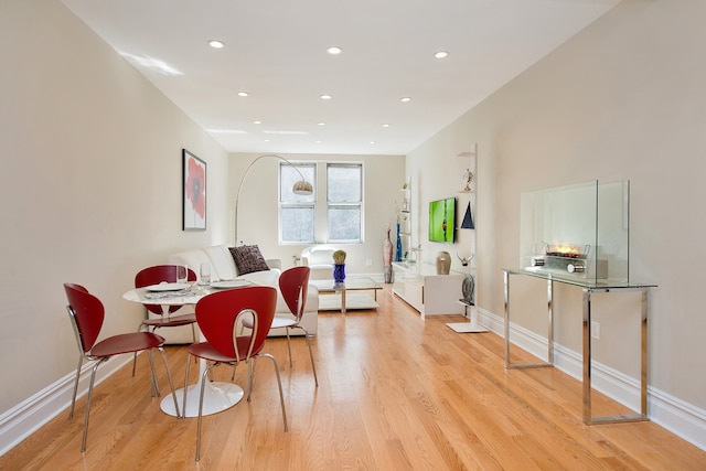 interior space with recessed lighting, baseboards, and light wood-style flooring