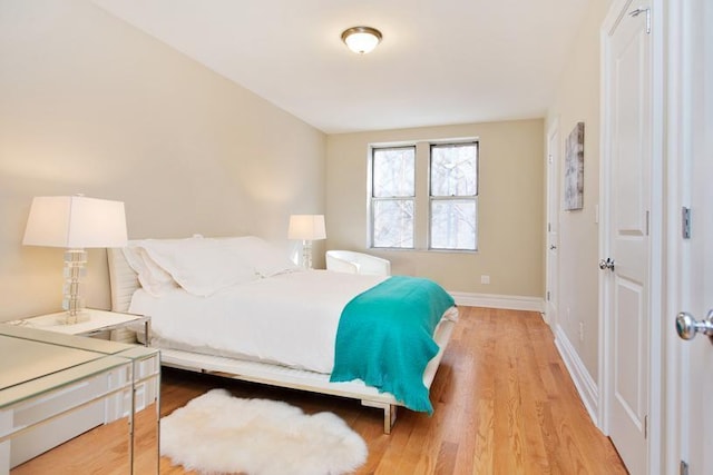 775 Riverside Dr Unit 3D, New York City, NY 10032 - bedroom featuring baseboards and light wood-type flooring