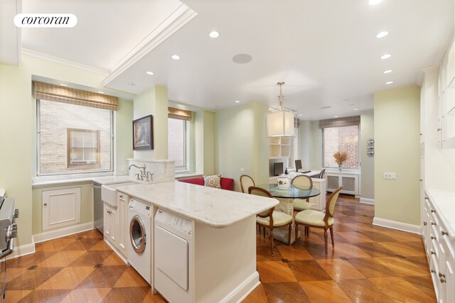 sitting room featuring wallpapered walls, baseboards, and ornamental molding