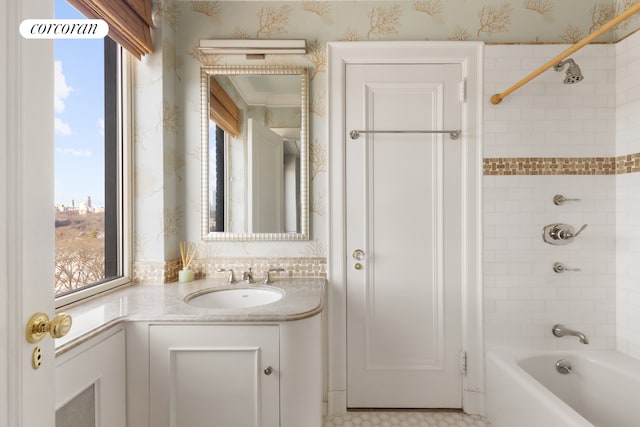 full bathroom with a wealth of natural light, vanity, wallpapered walls, and bathing tub / shower combination