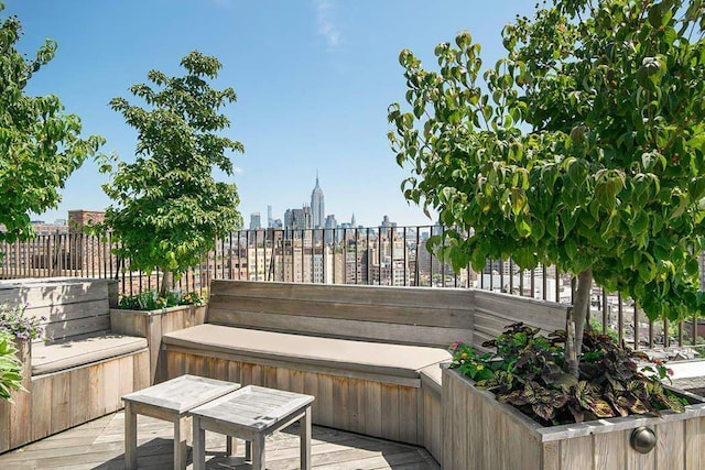 wooden terrace featuring a view of city