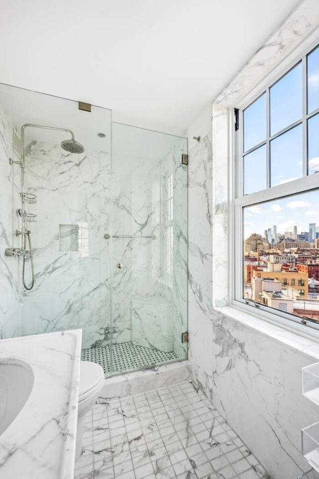 full bath featuring a marble finish shower, a view of city, toilet, and marble finish floor