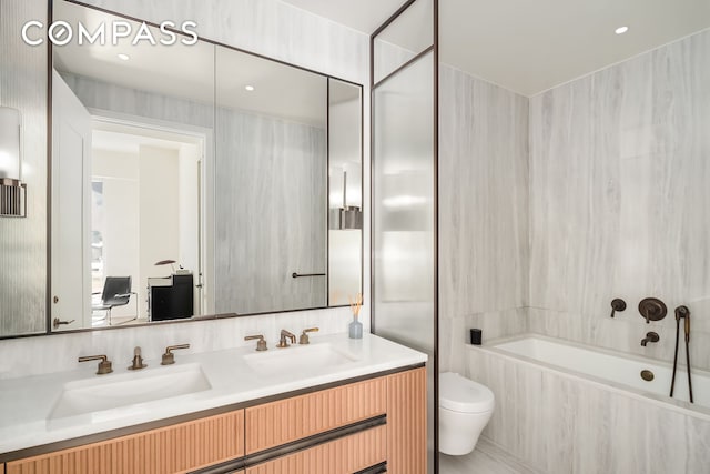 bathroom featuring a sink, toilet, and double vanity