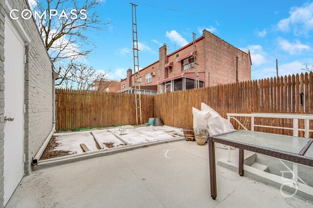 view of patio featuring a fenced backyard